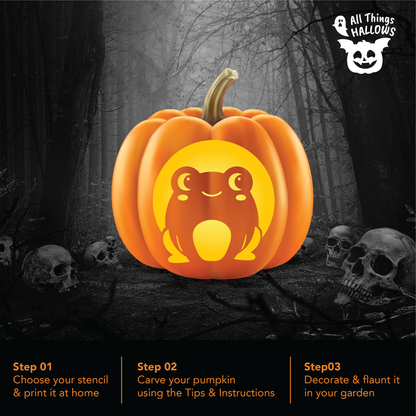 Cute Frog Pumpkin Stencil carved on an orange pumpkin displayed in a spooky Halloween forest surrounded by skull decorations.