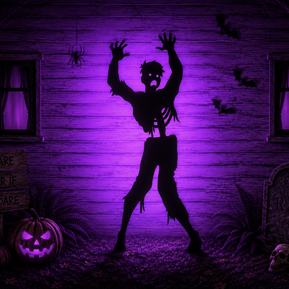 Large zombie yard stencil displayed as a spooky Halloween silhouette with raised arms against a purple-lit haunted house background.